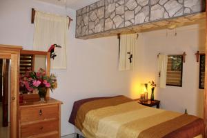 Postel nebo postele na pokoji v ubytování Villas Pico Bonito