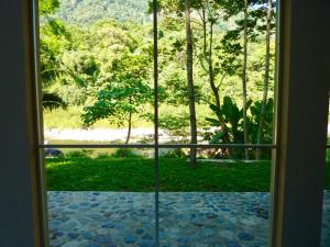 a view from a door looking out at a garden at Villas Pico Bonito in La Ceiba