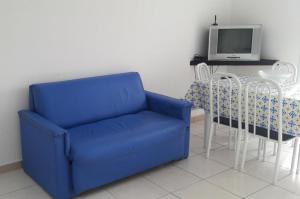 Ein Sitzbereich in der Unterkunft Itanhaém flat residence