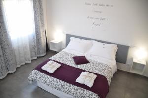 Postel nebo postele na pokoji v ubytování B&B La Veranda di Gio