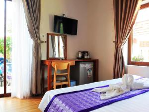 Postel nebo postele na pokoji v ubytování Ms Tri Homestay