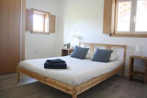 Ένα ή περισσότερα κρεβάτια σε δωμάτιο στο Casa Moderna Proxima da Praia