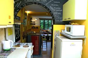 a kitchen with an archway in a kitchen at Shanti Hostel in Skopje