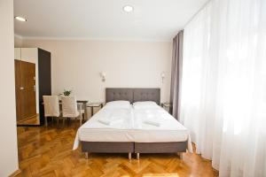 Posteľ alebo postele v izbe v ubytovaní R&B APARTMENTS POZNAŃ