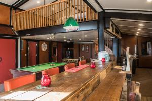 a large room with a pool table and ping pong ball at The Wild Atlantic Way Barn in Oranmore