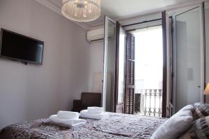 Posteľ alebo postele v izbe v ubytovaní Opening Doors Aribau