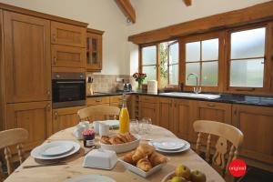 a kitchen with a table with food on it at Jacks Cottage in Totnes