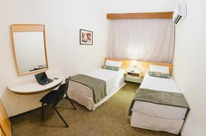 Postel nebo postele na pokoji v ubytování Hotel Aladdin