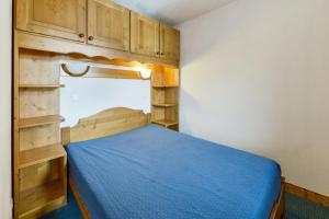 En eller flere senge i et værelse på Quartier La Forêt - maeva Home