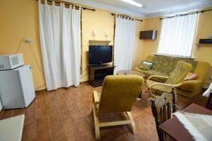 TV a/nebo společenská místnost v ubytování Penzion Klášter