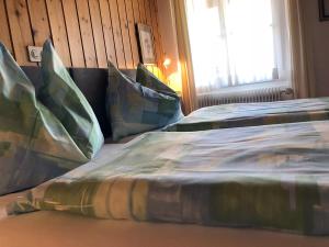 Postel nebo postele na pokoji v ubytování Post Hardermannli