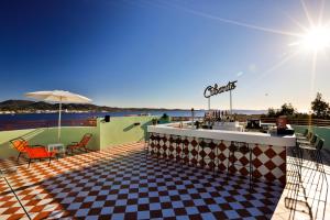 a restaurant with a checkered floor and a bar at Cubanito Ibiza in San Antonio