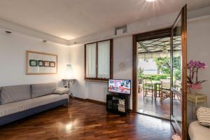 TV/trung tâm giải trí tại Sirmio Apartments - Primavera Stay