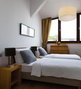 Postel nebo postele na pokoji v ubytování Luxoise Apartments