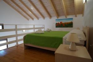 Postel nebo postele na pokoji v ubytování Il Giardino Del Tiglio