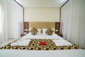 Postel nebo postele na pokoji v ubytování Spice Palace Hotel