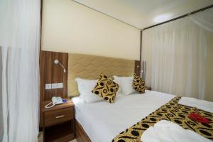 Postel nebo postele na pokoji v ubytování Spice Palace Hotel