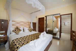Postel nebo postele na pokoji v ubytování Spice Palace Hotel