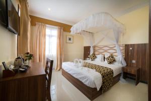 Postel nebo postele na pokoji v ubytování Spice Palace Hotel
