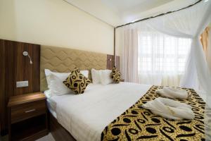 Postel nebo postele na pokoji v ubytování Spice Palace Hotel