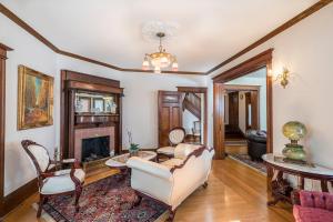 a living room with a couch and a fireplace at Victorian Seasons Stirling in East Marion