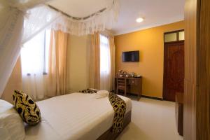 Postel nebo postele na pokoji v ubytování Spice Palace Hotel
