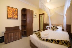 Postel nebo postele na pokoji v ubytování Spice Palace Hotel