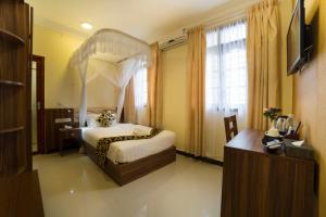 Postel nebo postele na pokoji v ubytování Spice Palace Hotel