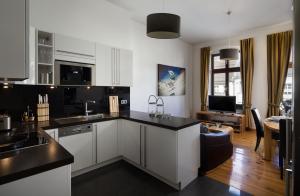 Kuchyň nebo kuchyňský kout v ubytování Luxoise Apartments