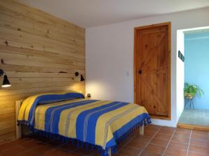 Un ou plusieurs lits dans un hébergement de l'établissement La Abuelita Hostal