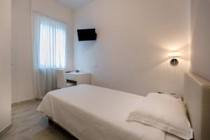 Postel nebo postele na pokoji v ubytování Hotel Saviola