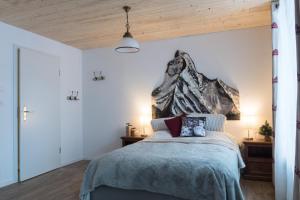 Tempat tidur dalam kamar di La Ferme des Arêtes