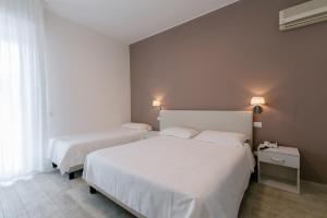 Postel nebo postele na pokoji v ubytování Hotel Saviola
