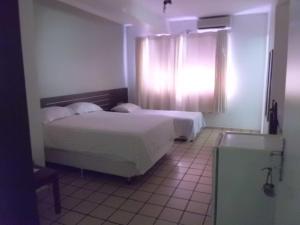 Katil atau katil-katil dalam bilik di Hotel Rio Mar