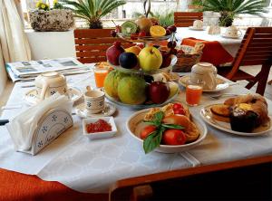a table with many plates of food on it at Antica Terrazza in Morciano di Leuca +24 photos