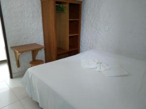 מיטה או מיטות בחדר ב-Summer Hotel