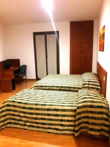Postel nebo postele na pokoji v ubytování Hotel Nicolaj