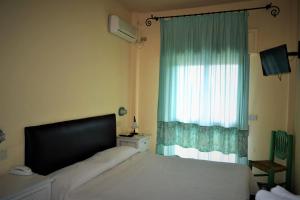 Postel nebo postele na pokoji v ubytování Hotel dell'Ancora