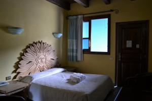 Postel nebo postele na pokoji v ubytování Hotel dell'Ancora