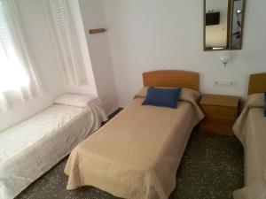 Postel nebo postele na pokoji v ubytování Pensíon Lucia