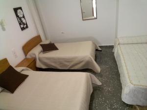 Postel nebo postele na pokoji v ubytování Pensíon Lucia