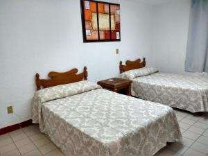 Cama o camas de una habitación en Hotel SPA Taninul