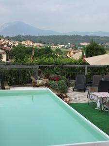 a swimming pool on the roof of a house at Borgo Piccolo in Cavaion Veronese