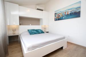 Postel nebo postele na pokoji v ubytování Apartments Besker