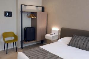 Voodi või voodid majutusasutuse Hotel Buena Onda toas