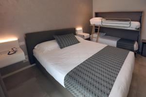 Voodi või voodid majutusasutuse Hotel Buena Onda toas
