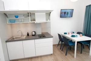 Kuchyň nebo kuchyňský kout v ubytování Apartments Besker