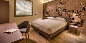 Voodi või voodid majutusasutuse Hotel The Cube toas