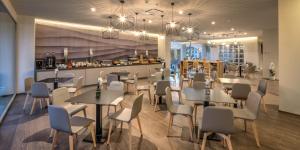 Restoran või mõni muu söögikoht majutusasutuses Hotel The Cube