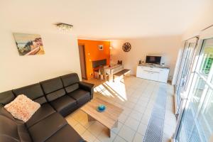 a living room with a couch and a table at Haus Jasmund in Binz